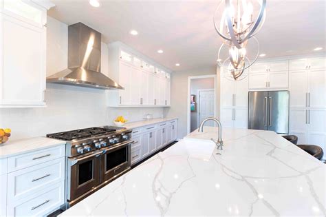 white cabinets with marble countertops